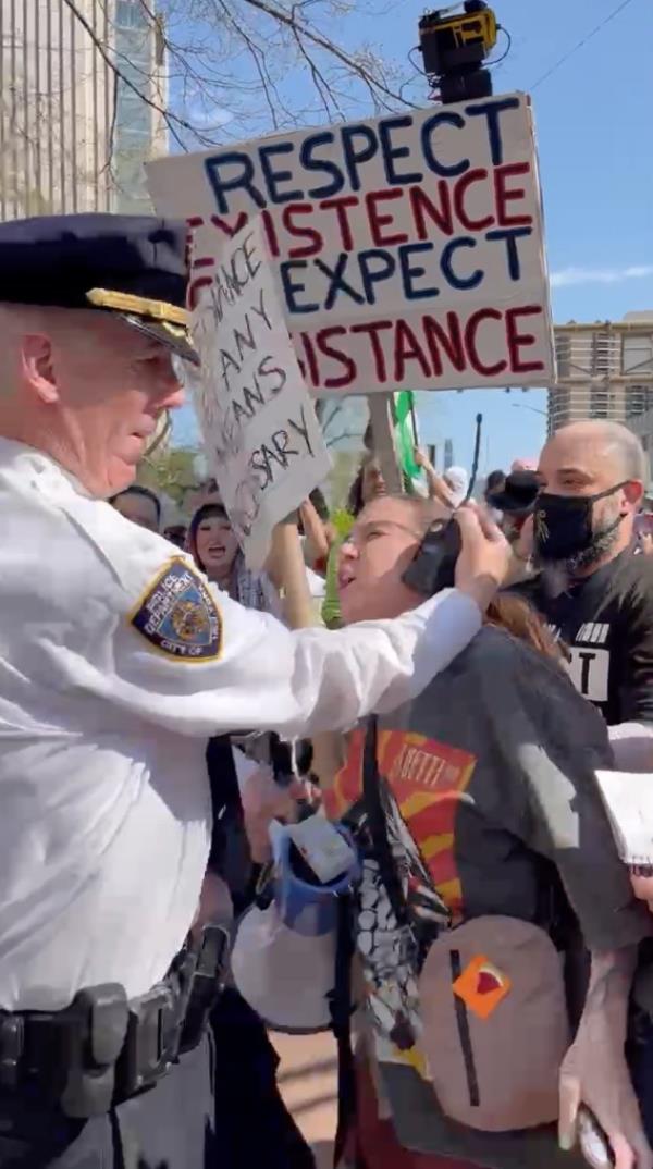 NYPD Deputy Chief Timothy Beaudette clashing with a protestor on the Brooklyn Bridge.