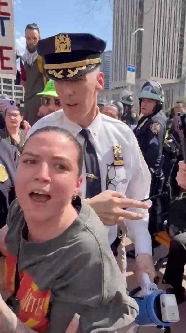 NYPD Deputy Chief Timothy Beaudette in an altercation with an unidentified protestor during a pro-Palestinian demo<em></em>nstration on the Brooklyn Bridge