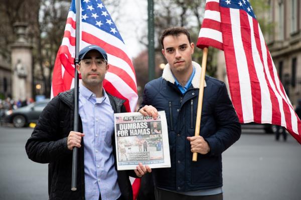 Columbia Jewish students holding American flags. 