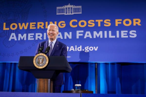President Joe Biden speaking a<em></em>bout his student debt relief plan at podium in Central New Mexico Community College