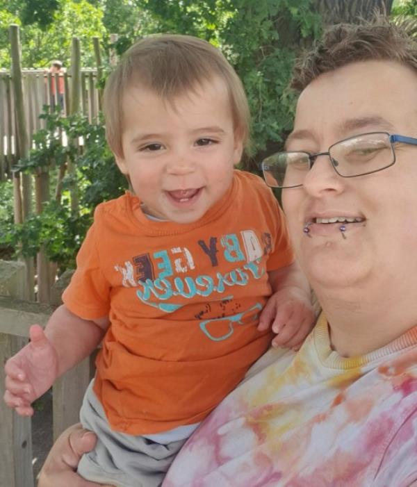 Jacob Bouyer smiling together with his four-year-old child