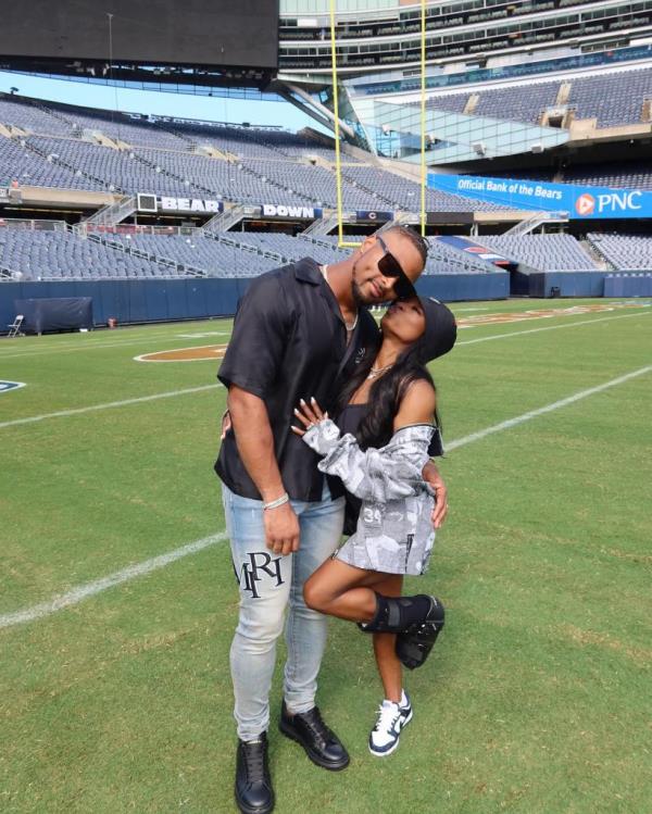 Simone Biles cozies up to husband Jo<em></em>nathan Owens during a Bears preseason game in August 2024.
