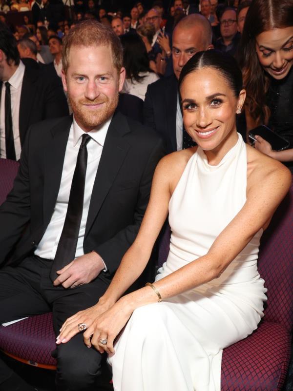 Prince Harry and Meghan Markle smiling. 