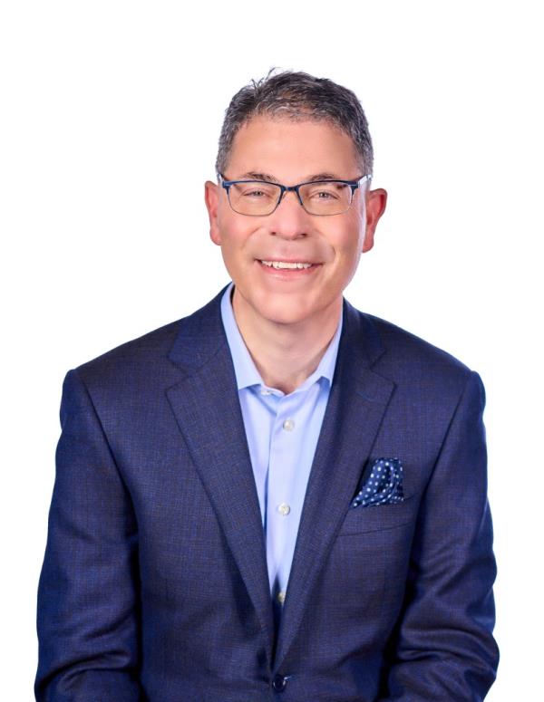 Macy's chairman and CEO, Tony Spring, dressed in a suit