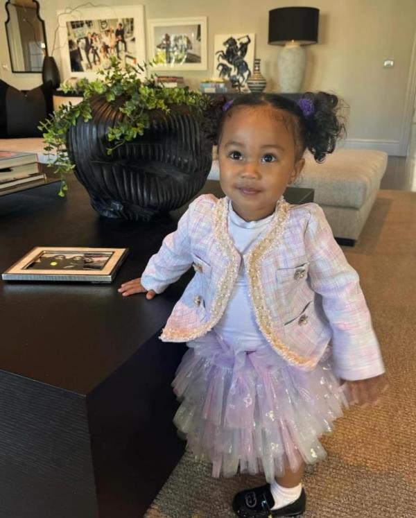 Several of the other photos show the child, who is shared between Combs and ex-Dana Tran, walking in a field and holding o<em></em>nto a table. 