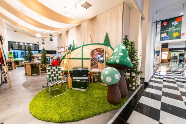Interior image of Camp Bloomingdale's shows a lawn chair and inflatable mushrooms.