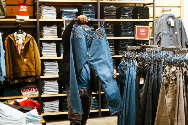 A shopper looks at jeans inside a Levi's store.