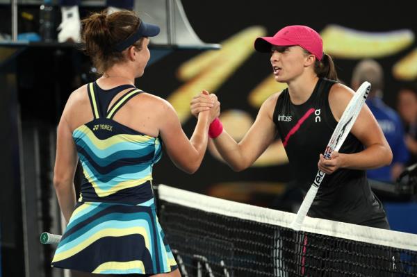 Iga Swiatek (right) shakes hands with Linda Noskova following their third-round match on Saturday at the 2024 Australian Open.