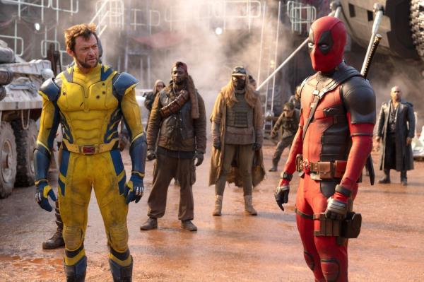 Hugh Jackman's wolverine staring at Ryan Reynolds' Deadpool 