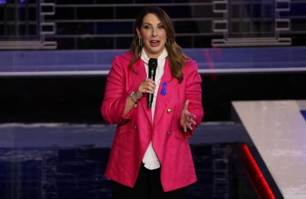 Republican Natio<em></em>nal Committee Chair Ro<em></em>nna McDaniel in a pink jacket speaking into a microphone at the third Republican presidential debate in Miami, Florida, 2024