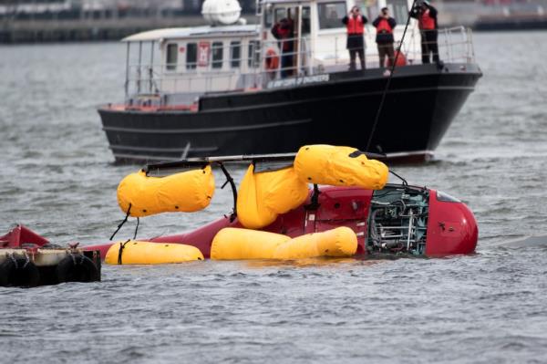 The helicopter on its side in the water</p>

<p>　　