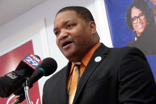 Atlantic City Mayor Marty Small Sr. giving a press co<em></em>nference in a suit, speaking into a microphone