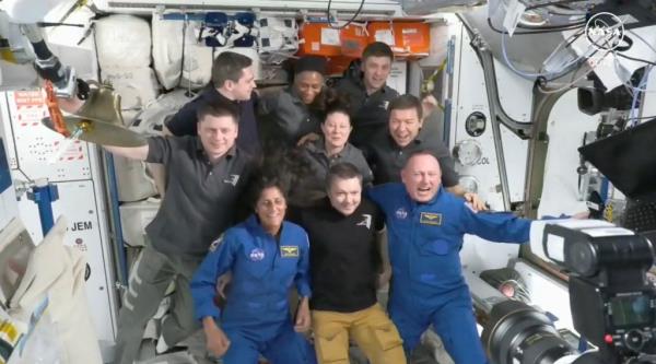 Suni Williams and Butch Wilmore pose for a photo with seven other astro<em></em>nauts aboard the ISS. 