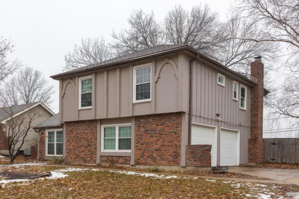 A house with a back yard, garage, and driveway at Jordan Willis' home in The Coves, Kansas City, MO wher<em></em>e his friends were found deceased