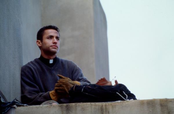 Kamar de los Reyes, 1998 in a priest outfit. 