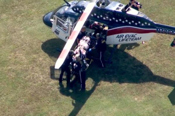 An injured person being evacuated from the school by a helicopter.