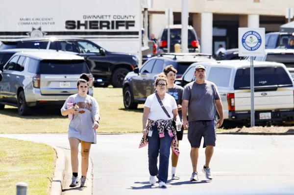 Parents walking students out of the high school.