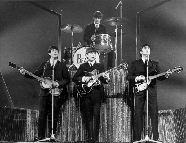 The Beatles perform on stage at the Lo<em></em>ndon Palladium.