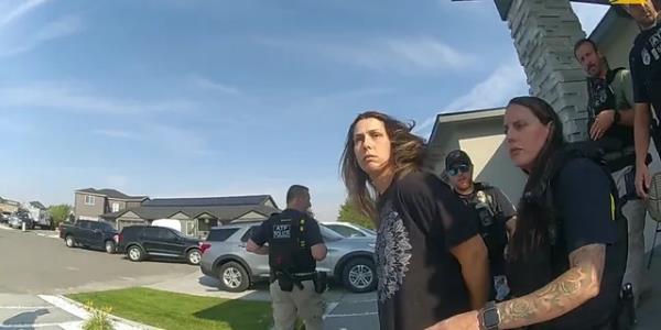 Shanna Gardner-Fernandez escorted from her home by police