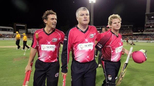 28/01/2012 WIRE: PERTH, AUSTRALIA - JANUARY 28: <em></em> Stephen O'Keefe (L) Stuart MacGill (C) and Steve Smith (R) of the Sixers leave the field after the teams win during the T20 Big Bash League Grand Final match between the Perth Scorchers and the Sydney Sixers at WACA on January 28, 2012 in Perth, Australia. <em></em> (Photo by Will Russell/Getty Images)