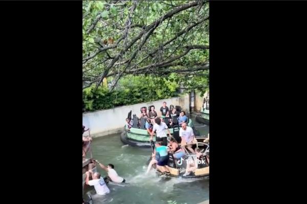 people jumping off water ride