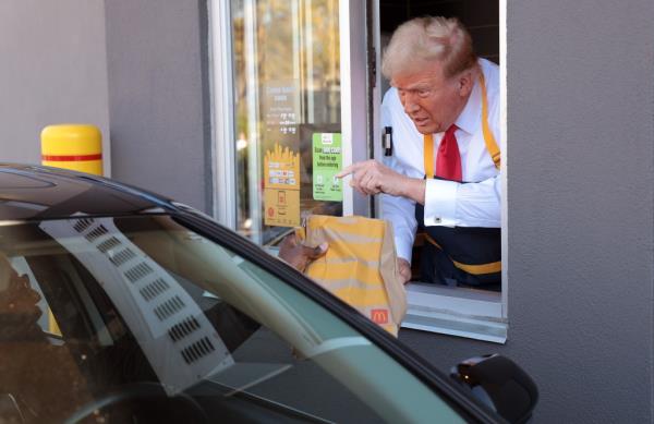 Former President Do<em></em>nald Trump working the drive-through line at a McDonald's restaurant in Feasterville-Trevose, Pennsylvania during his 2024 presidential campaign