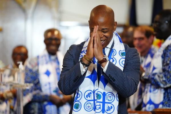 New York City Mayor Eric Adams bows his head and prays at the Emmanuel Presbyterian Reformed Church as church members celebrated the church's 25th anniversary on Sunday, September 29, 2024 in The Bronx