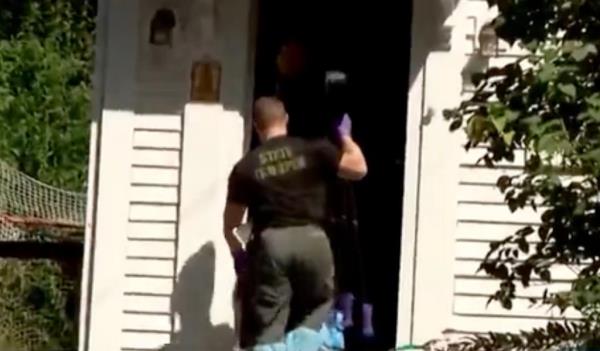 A state trooper is seen entering Talcott's house over the weekend.