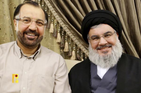 Hezbollah leader Sayyed Hassan Nasrallah, right, posing for a picture with Fuad Shukr, a Hezbollah top commander who was killed by an Israeli airstrike.