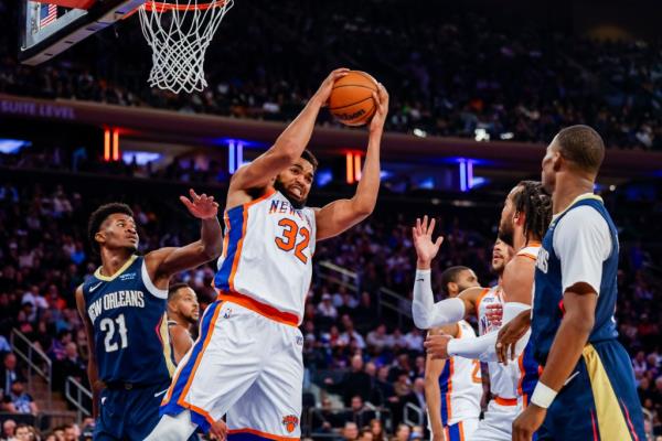 Knicks center Karl-Anthony Towns (32) pulls down a rebound during the first half at Madison Square Garden, Sunday, Dec. 1, 2024.