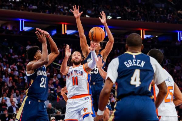 New York Knicks guard Jalen Brunson (11) makes a jumping pass during the second half at Madison Square Garden, Sunday, Dec. 1, 2024.