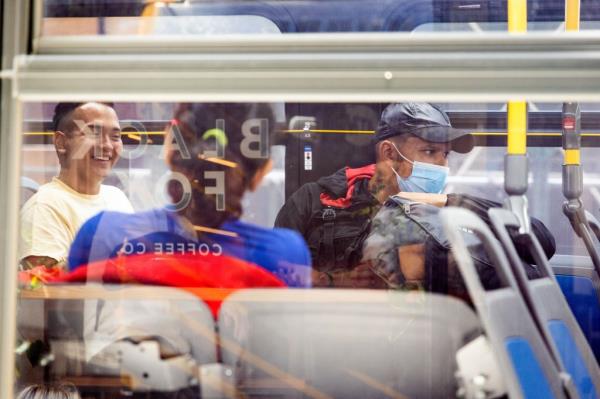 Migrants on a bus.