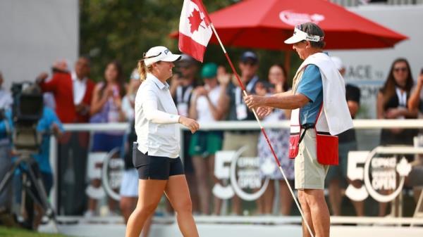A victorious Lauren Coughlin on the 18th green