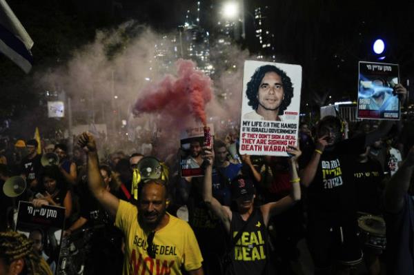 People attend a rally demanding a cease-fire deal and the immediate release of hostages held by Hamas in the Gaza Strip after the deaths of six hostages in the Palestinian territory in Tel Aviv, Israel.