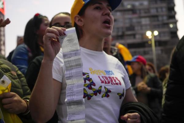 Venezuelans in Chile protest against Maduro a mo<em></em>nth after the disputed vote, which the opposition says it won by a landslide.