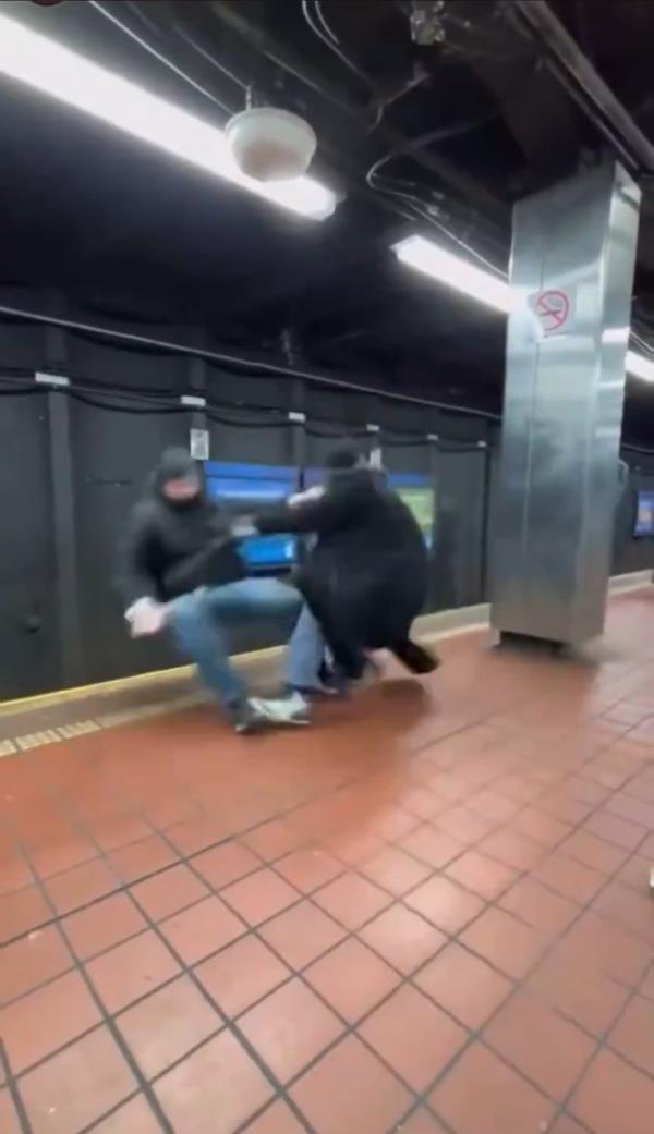 The man gets hit in the face and is seen falling backward.