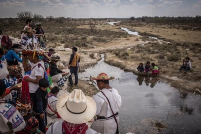 Wixárika pilgrims blessing water during their pilgrimage to Wirikuta.