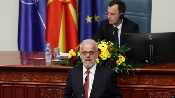 Talat Xhaferi, nominated to serve as prime minister of North Macedonia's caretaker government, speaks to lawmakers during a session of parliament, in Skopje, Jan. 28, 2024.