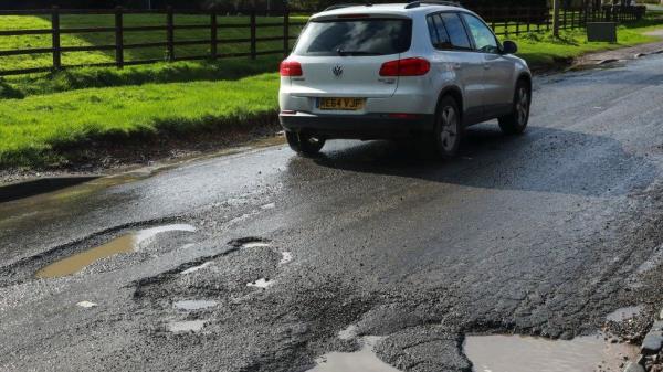 car and potholes