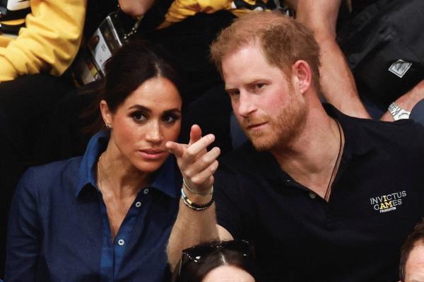 Prince Harry, Duke of Sussex and his wife Meghan, Duchess of Sussex, attend the sitting volleyball finals at the 2023 Invictus Games.