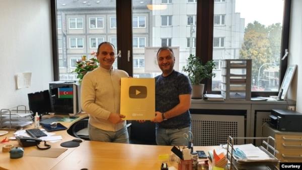 Aziz Orujov, left, and Anar Orujov, right, celebrate Kanal 13 reaching 1 million subscribers on YouTube in October, 2022. Aziz Orujov was arrested in late November on illegal co<em></em>nstruction charges that media advocates view as retaliatory. (Photo courtesy of Ulviyya Mammadova)